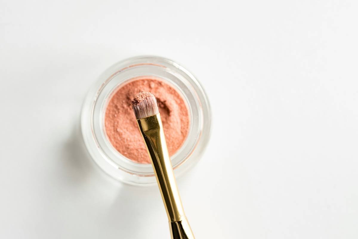 Before-and-after photo showing sparse, uneven brows transformed into full, natural-looking arches using eyebrow shaping powder