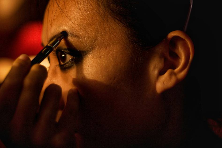 Close-up of finely milled eyebrow powder in neutral tones with soft brush strokes
